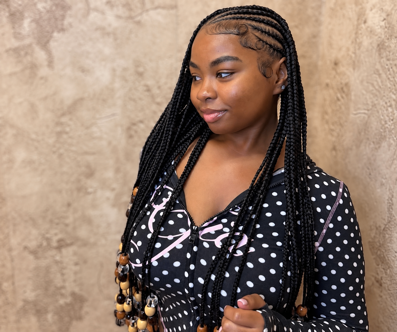 Long box braids finished with wooden and clear beads