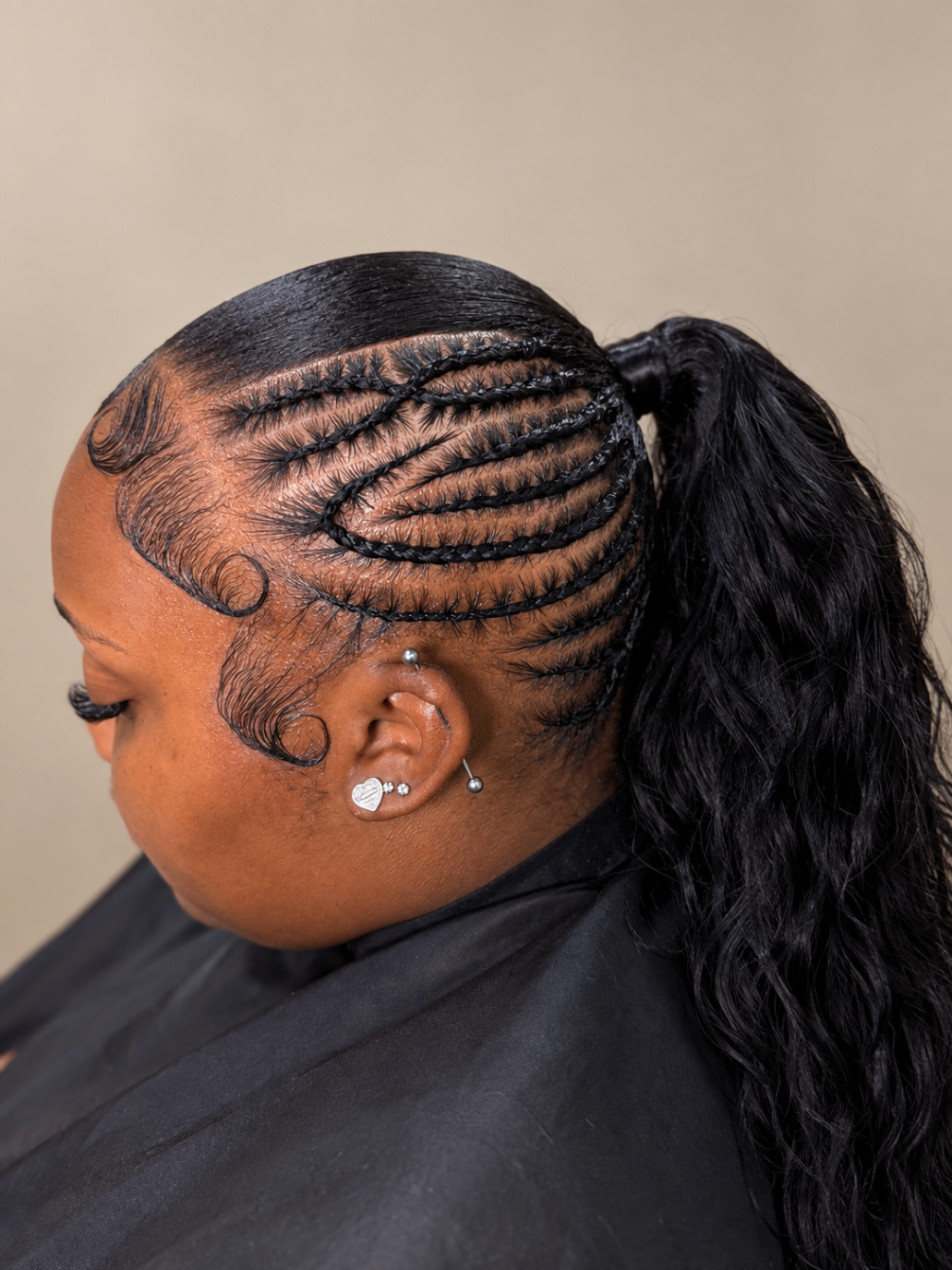 Close view of a braided ponytail with sculpted edges